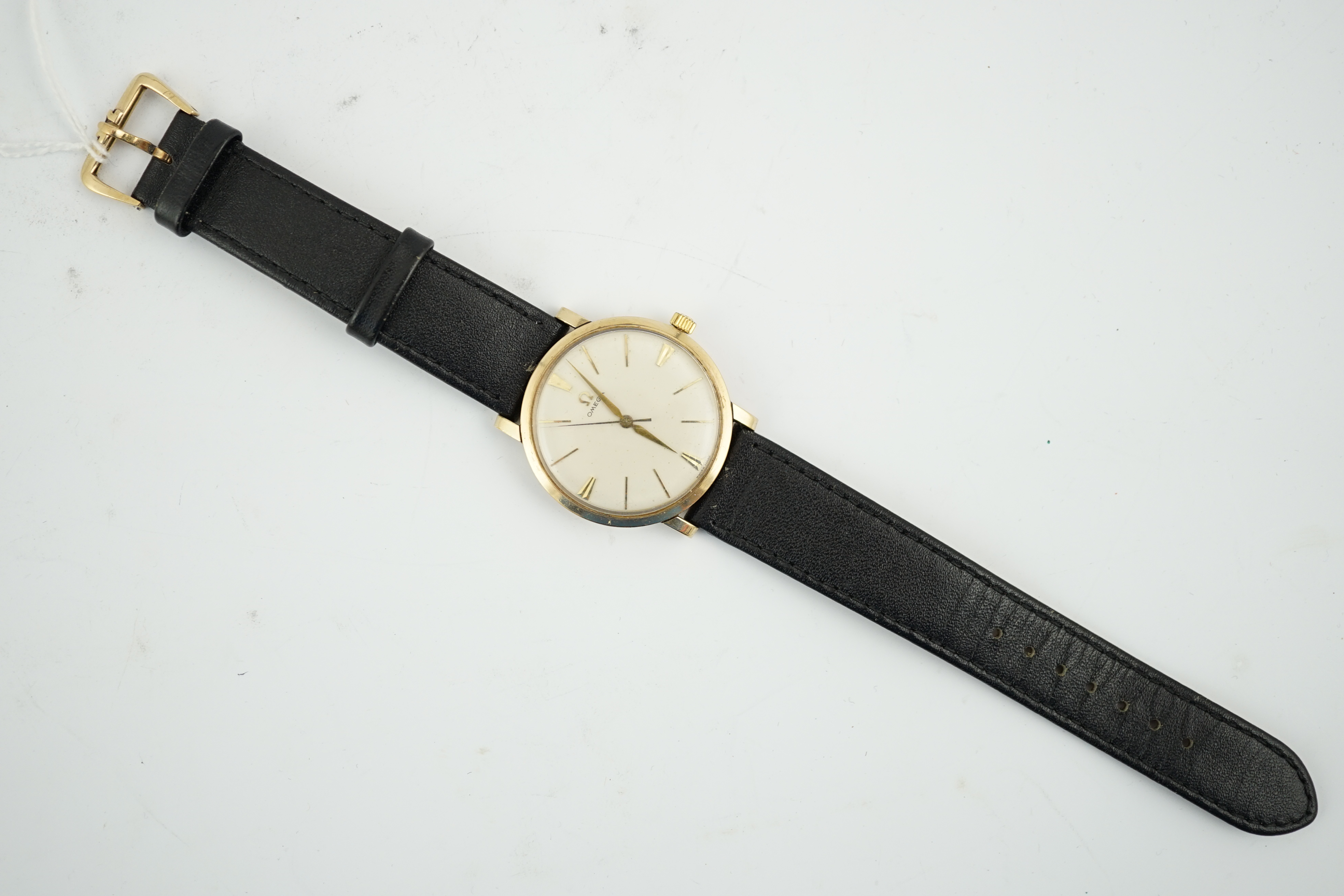 A gentleman's gold Omega manual wind wrist watch